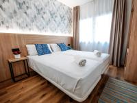 Posteľ alebo postele v izbe v ubytovaní Sweet Lloret Suites