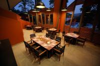 an overhead view of a restaurant with tables and chairs at Vyna Hillock Resort in Vythiri