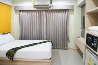 Postel nebo postele na pokoji v ubytování La Porte Hotel Bangkok
