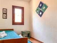 A bed or beds in a room at Villetta Gaia