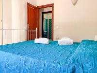 A bed or beds in a room at Villetta Gaia