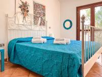 A bed or beds in a room at Villetta Gaia