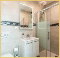 a bathroom with a toilet and a sink and a shower at Appart T3 Luxe Douvaine in Douvaine