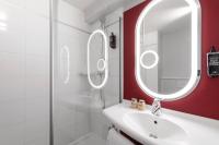 a bathroom with a sink and a mirror at ibis Paris Bastille Faubourg St Antoine in Paris