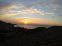 a view of the sunset from the roof of a house at Résidence le Village de Cap Esterel - maeva Home - Appartement 2 Pièces 5 Per 27 in Saint-Raphaël
