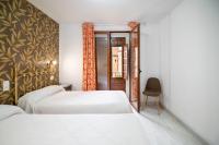 Cama o camas de una habitación en Hotel Manzanito