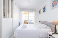 a white bedroom with a bed with white sheets and pillows at Quiet 1 bdr Port! close Place du Pin Garibaldi in Nice