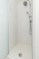 a shower with a glass door with a shower head at Quiet 1 bdr Port! close Place du Pin Garibaldi in Nice