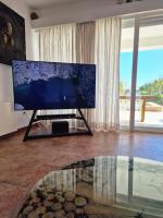 A television and/or entertainment centre at Villa Domino Ibiza