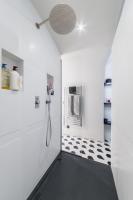 a bathroom with a black and white tile floor at Wonderful luxury house at 10min from Paris in Meudon