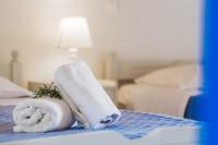 A bed or beds in a room at Sunflower Apartments & Studios