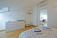 A bed or beds in a room at Sky View Apartment