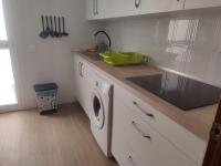 A kitchen or kitchenette at APT ALCAZABA by Malaga Picasso Rentals Selection