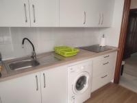 A kitchen or kitchenette at APT ALCAZABA by Malaga Picasso Rentals Selection