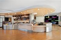 a restaurant with a bar in a large room at Courtyard by Marriott San Jose North/ Silicon Valley in San Jose