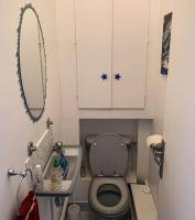 a small bathroom with a toilet and a mirror at Confort Parisien - parking gratuit - Chaleureux in Rueil-Malmaison