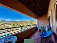 a balcony with a table and chairs and a view at Appartement Les Issambres, 2 pièces, 4 personnes - FR-1-226-540 in La Garonnette-Plage