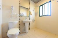 a bathroom with a toilet and a sink at 晶藍色美人魚 Mermaid Inn in Hualien City