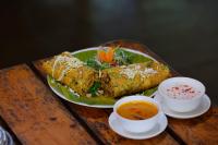 a plate of food on a table with a bowl of soup at Brown Town Resort & Spa in Hyderabad