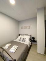 Posteľ alebo postele v izbe v ubytovaní Dima Rooms And Apartments