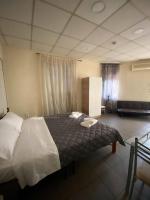 Posteľ alebo postele v izbe v ubytovaní Dima Rooms And Apartments