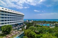 a hotel with a view of a pool and the ocean at Concorde De Luxe Resort - Prive Ultra All Inclusive in Lara