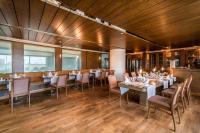 a dining room with long tables and chairs at Concorde De Luxe Resort - Prive Ultra All Inclusive in Lara