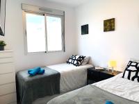 A bed or beds in a room at Magnifico apartamento de planta alta LA ISLA