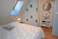 a bedroom with a bed and a sink and a mirror at Chambres d&#39;hôtes Chez Caroline in Colmar