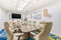a boardroom with a conference room with a table and chairs at Hilton Irvine/Orange County Airport in Irvine