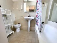 a bathroom with a sink and a toilet and a bath tub at Appartement Six-Fours-les-Plages, 2 pièces, 5 personnes - FR-1-316-118 in Six-Fours-les-Plages