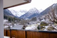 a view of a snowy mountain range from a balcony at Haus Kella-Egg in Brand