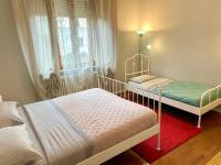 Łóżko lub łóżka w pokoju w obiekcie La Maison de Mathilde