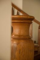 a wooden vase sitting next to a set of stairs at Alps Garden B&amp;B in Wujie