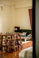 a teddy bear sitting on a table in a room at Alps Garden B&amp;B in Wujie