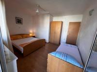 Postel nebo postele na pokoji v ubytování Apartmani Leila