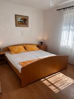Postel nebo postele na pokoji v ubytování Apartmani Leila