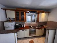 Kuchyň nebo kuchyňský kout v ubytování Apartmani Leila