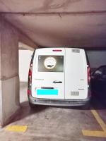 a white car is parked in a parking garage at Saint-Raphaël-Front de Mer-WIFI-CLIM in Saint-Raphaël