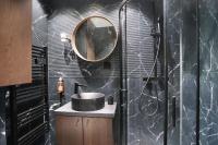 a bathroom with a sink and a mirror at Studio Sacré coeur by Studio prestige in Paris