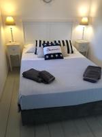 A bed or beds in a room at Anthos House
