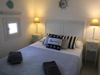 A bed or beds in a room at Anthos House