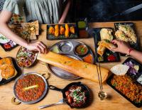 een tafel met veel verschillende soorten voedsel bij Modern Mansion in Lightsview By Host Solutions in Northfield