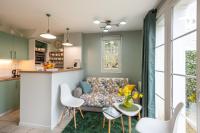 a living room with a couch and a table at Belle Dune in Fort-Mahon-Plage