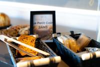 a display of bread and other snacks in baskets at Hôtel Mar I Cel &amp; Spa in Canet-en-Roussillon
