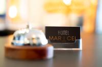 a sign for a hotel marlite sitting on a table at Hôtel Mar I Cel &amp; Spa in Canet-en-Roussillon