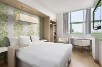 Een bed of bedden in een kamer bij NH Amsterdam Noord