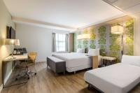 Een bed of bedden in een kamer bij NH Amsterdam Noord