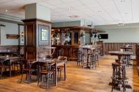 De lounge of bar bij NH Amsterdam Noord