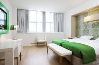 Een bed of bedden in een kamer bij NH Amsterdam Noord